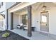 Inviting front porch showcasing elegant columns, cozy seating, and a stylish welcome area at 1501 Branthaven Ln, Auburn, GA 30011