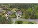 Wide aerial view of two traditional homes surrounded by mature trees and large lawns at 332 Chaffin Rd, Roswell, GA 30075