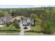 Beautiful aerial view of a traditional home with lush landscaping and a circular driveway at 332 Chaffin Rd, Roswell, GA 30075