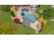 Aerial view of backyard pool and outdoor entertaining area with cabana at 332 Chaffin Rd, Roswell, GA 30075