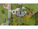 Aerial view showcasing a home with a pool, outdoor living space, and pristine landscaping at 332 Chaffin Rd, Roswell, GA 30075