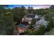 Aerial view of a backyard with a pool, hot tub, patio, outdoor kitchen, and solar panels at 332 Chaffin Rd, Roswell, GA 30075