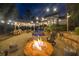 Spacious backyard with a fire pit, pool, waterfall feature, and outdoor kitchen with bar seating at 332 Chaffin Rd, Roswell, GA 30075