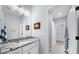 Bathroom featuring a granite counter and a view of the walk-in shower, highlighting a clean design at 332 Chaffin Rd, Roswell, GA 30075