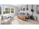 Bonus room with a desk and sofa featuring guitars mounted on the wall, great for music lovers at 332 Chaffin Rd, Roswell, GA 30075