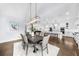 Open concept dining room, featuring a contemporary chandelier and seamless transition to the modern kitchen at 332 Chaffin Rd, Roswell, GA 30075