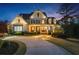 Inviting exterior view showcasing a well-maintained home with elegant lighting and landscaping at 332 Chaffin Rd, Roswell, GA 30075