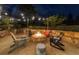 Stone patio featuring a built-in fire pit with Adirondack chairs, perfect for outdoor gatherings at 332 Chaffin Rd, Roswell, GA 30075