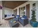Inviting front porch with comfortable seating and a classic hanging porch swing at 332 Chaffin Rd, Roswell, GA 30075
