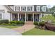 Inviting front porch with seating, brick walkway, and professionally landscaped garden at 332 Chaffin Rd, Roswell, GA 30075