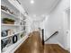 Bright hallway features built-in bookshelves and hardwood floors, offering both style and functionality at 332 Chaffin Rd, Roswell, GA 30075
