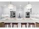Upgraded kitchen island with granite counters, breakfast bar, and stainless appliances at 332 Chaffin Rd, Roswell, GA 30075