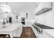 Chef's kitchen featuring a large island, stainless steel appliances, and a professional-grade cooktop at 332 Chaffin Rd, Roswell, GA 30075