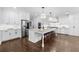 Stylish kitchen with white cabinets, granite countertops, and a large island with seating at 332 Chaffin Rd, Roswell, GA 30075