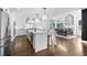 Modern open concept kitchen with white cabinetry, large island, and stainless steel appliances at 332 Chaffin Rd, Roswell, GA 30075