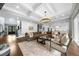 Spacious living room with modern fireplace, large sectional sofa, and open access to kitchen at 332 Chaffin Rd, Roswell, GA 30075