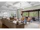Spacious living room features coffered ceilings, hardwood floors, and seamless access to an outdoor porch at 332 Chaffin Rd, Roswell, GA 30075