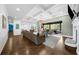 Bright and airy living room with hardwood flooring and access to an outdoor porch at 332 Chaffin Rd, Roswell, GA 30075