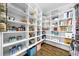 Walk-in pantry with ample shelving, providing abundant storage space for groceries and kitchen essentials at 332 Chaffin Rd, Roswell, GA 30075