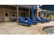 Relaxing patio featuring lounge chairs with brick, open-air construction, and access to the home's back door at 332 Chaffin Rd, Roswell, GA 30075