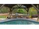 Poolside bar with outdoor grill and kitchen area beneath covered cabana at 332 Chaffin Rd, Roswell, GA 30075
