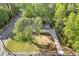 An aerial view of the house and its surroundings with a boundary box marking the property limits at 4718 Lou Ivy Rd, Peachtree Corners, GA 30096