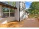 Home featuring outdoor living space with a large deck for relaxing and entertaining at 4718 Lou Ivy Rd, Peachtree Corners, GA 30096