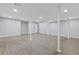 Open basement with new floors and neutral paint offers flexible living space at 4718 Lou Ivy Rd, Peachtree Corners, GA 30096