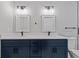 Modern bathroom with double sinks, marble countertops, and sleek, black fixtures at 4718 Lou Ivy Rd, Peachtree Corners, GA 30096