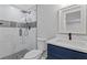 Beautiful bathroom featuring a glass shower with black accents and stylish vanity at 4718 Lou Ivy Rd, Peachtree Corners, GA 30096