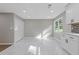 Bright dining room with white cabinets, white marble-look flooring, and recessed lighting at 4718 Lou Ivy Rd, Peachtree Corners, GA 30096