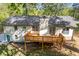 Image showcasing the back exterior of the house, which includes a deck and a lawn at 4718 Lou Ivy Rd, Peachtree Corners, GA 30096
