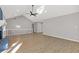 Open living room with vaulted ceilings and light-colored floors showcasing ample space at 4718 Lou Ivy Rd, Peachtree Corners, GA 30096