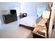 Bright main bedroom with cozy carpet, two sunny windows and stylish decor at 11212 Snowy Owl Ln, Alpharetta, GA 30022