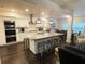 Modern kitchen featuring stainless steel appliances, a large island, and pendant lighting at 11212 Snowy Owl Ln, Alpharetta, GA 30022