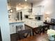Elegant kitchen features white cabinets, granite countertops, stainless appliances, and eat-in dining at 11212 Snowy Owl Ln, Alpharetta, GA 30022