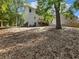 Spacious backyard with a gentle slope, offering potential for landscaping and outdoor activities in a secluded setting at 2438 Shadburn Ferry Dr, Buford, GA 30518