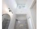 Modern bathroom featuring tiled shower, black hardware, and natural light at 2438 Shadburn Ferry Dr, Buford, GA 30518