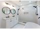 Spa-like bathroom with dual sinks, walk-in shower, garden tub, and modern fixtures at 2438 Shadburn Ferry Dr, Buford, GA 30518
