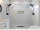Modern bathroom with walk-in shower, a niche in the wall, and dual shower heads at 2438 Shadburn Ferry Dr, Buford, GA 30518