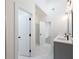 Bathroom featuring modern double vanity, tiled floor, and tiled shower at 2438 Shadburn Ferry Dr, Buford, GA 30518