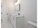 Clean bathroom features a modern sink, white cabinets, and contemporary black hardware at 2438 Shadburn Ferry Dr, Buford, GA 30518