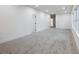Large bonus room with neutral carpet, recessed lighting, and freshly painted white walls at 2438 Shadburn Ferry Dr, Buford, GA 30518