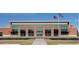 Commercial building featuring a brick facade, grand windows, and a modern design, ideal for businesses or community use at 2438 Shadburn Ferry Dr, Buford, GA 30518