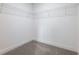Walk-in closet with neutral carpet, white walls, and installed wire shelving at 2438 Shadburn Ferry Dr, Buford, GA 30518