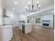 Contemporary kitchen with stainless steel appliances, quartz countertops, modern backsplash, and ample cabinet space at 2438 Shadburn Ferry Dr, Buford, GA 30518