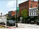Charming street view in Historic Buford, Georgia, featuring shops with vintage architecture, trees, and street parking at 2438 Shadburn Ferry Dr, Buford, GA 30518