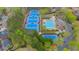 Aerial view of community amenities, including tennis courts and a large pool at 3605 Grey Abbey Dr, Alpharetta, GA 30022