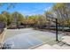 A basketball court beside the pool, surrounded by trees at 3605 Grey Abbey Dr, Alpharetta, GA 30022