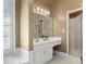 Well-lit bathroom featuring a double vanity, a large mirror, and a glass-enclosed shower stall at 3605 Grey Abbey Dr, Alpharetta, GA 30022